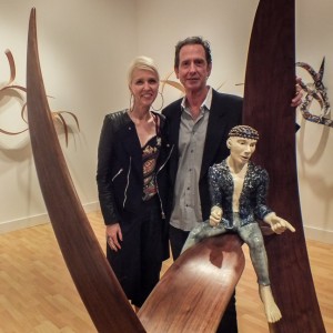 Photo of Regine Bechtler & Rick Lazes standing next to their sculpture.